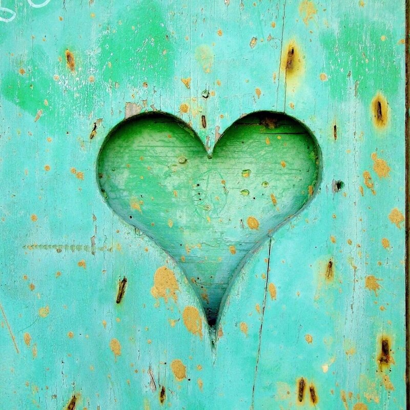 Image of a green heart on a wall with a cool pattern