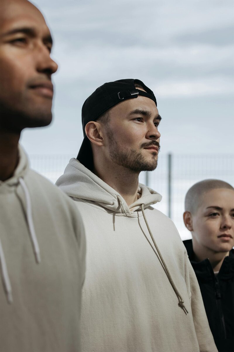 3 personal trainers standing in a row