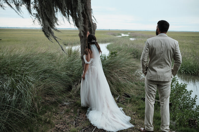 Eloping couple looking out at the intercoastal