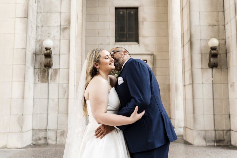 couple kissing on wedding day in downtown nashville