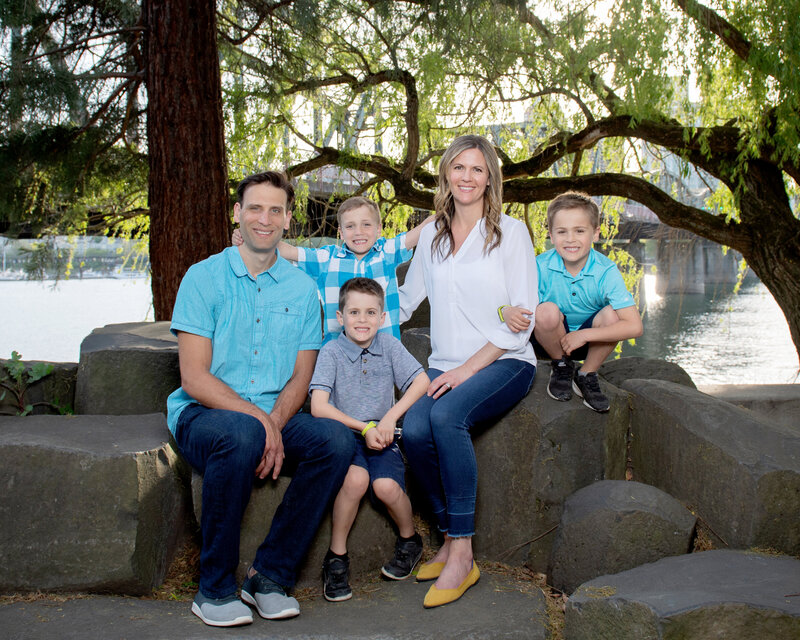 Family of five on rocks