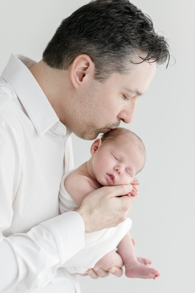 newborn in white swaddle by Nashville portrait photographer Kristie Lloyd