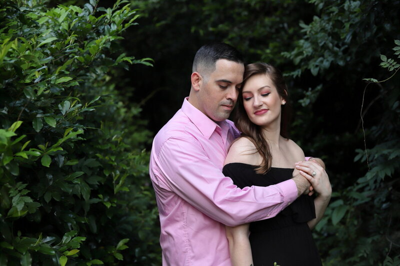 Sweet couple sharing a loving embrace in a quiet greenspace