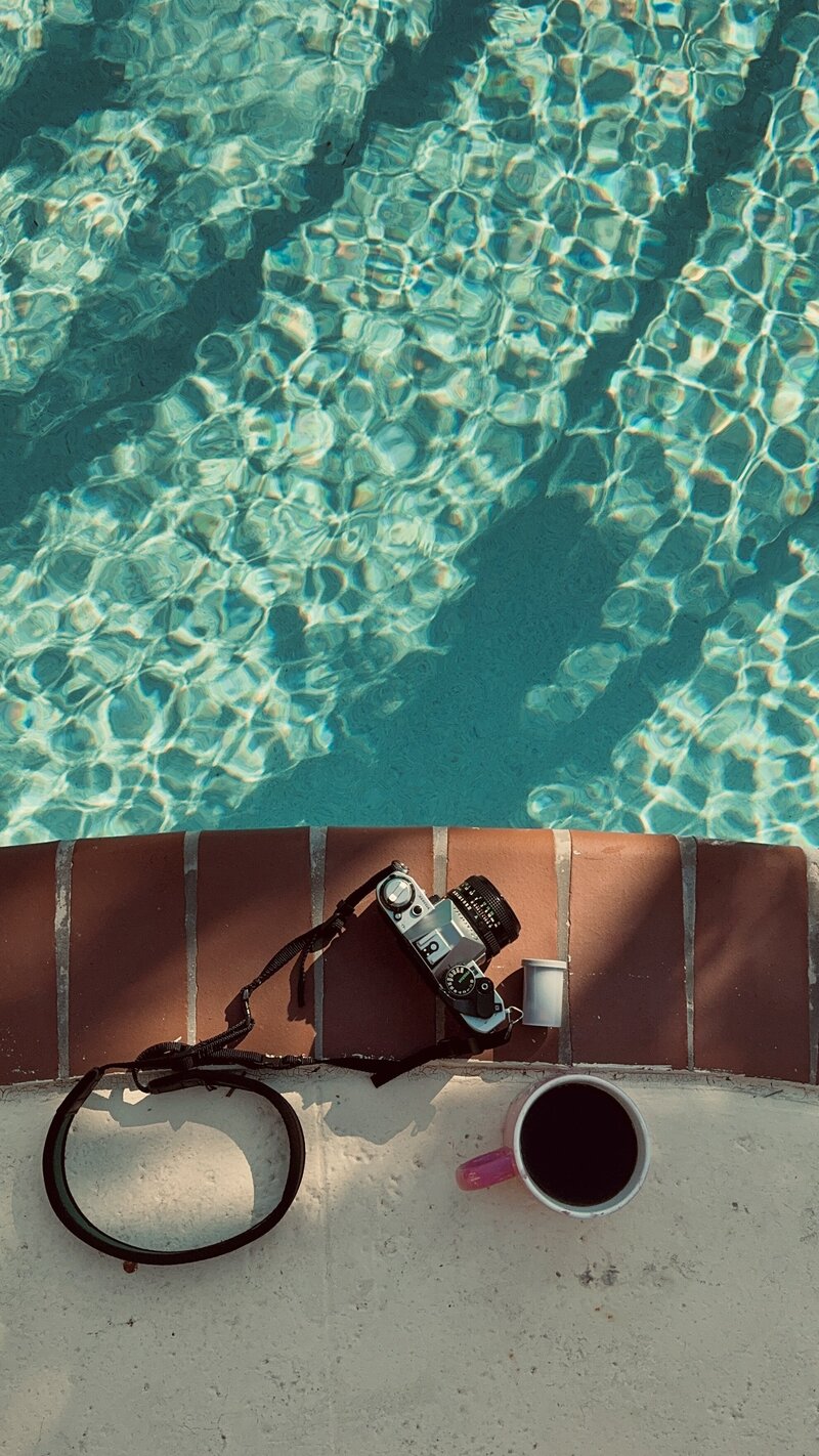 Natalia Baqueiro About Me Film Camera and Coffee by a pool