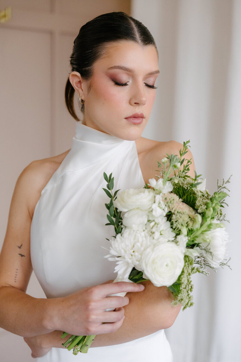 Bride with soft glam makeup and sleek bridal hair in Chicago, IL. Wedding hair and makeup services.