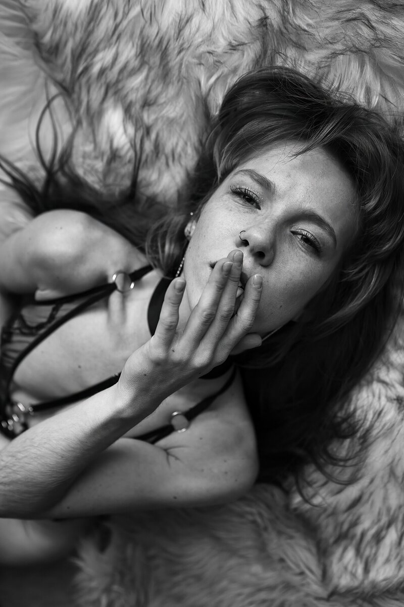 Michigan woman photographed in natural light during her intimate boudoir shoot.