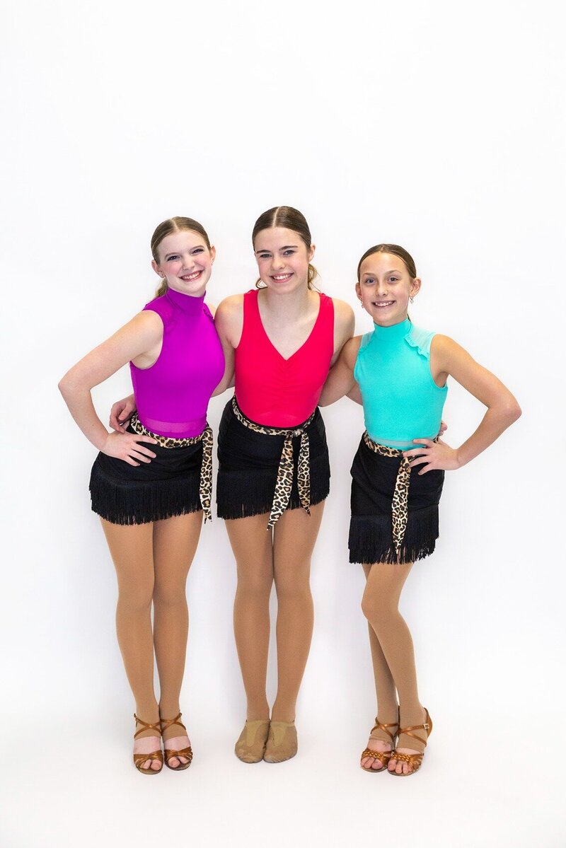Group of kids learning to dance in Curtsy Ballroom