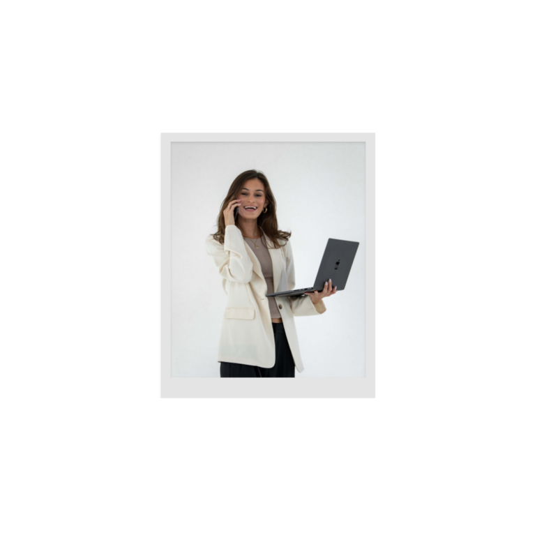 Polaroid image of woman  on phone holding laptop