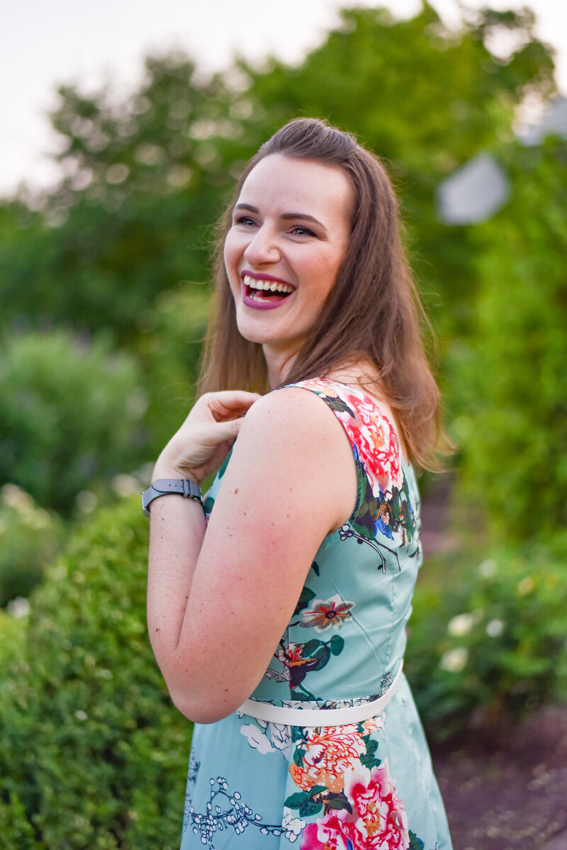 Amy Hord of Magical Minutes Photography laughing and wearing a colorful dress.