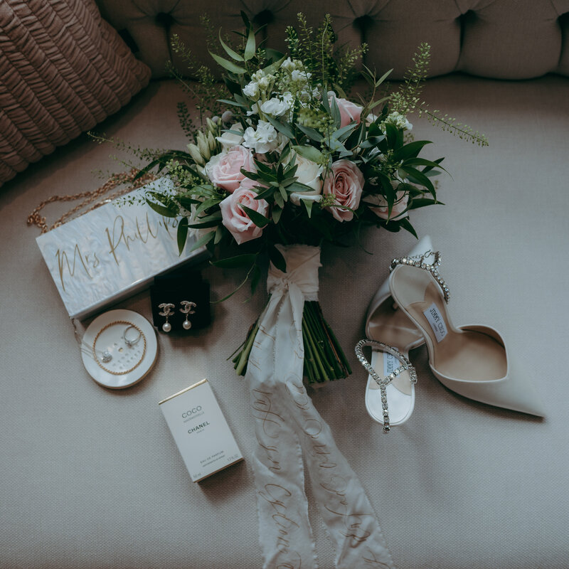 Wedding Flat-Lay of Flowers, Jimmy Choo Heels and Perfume