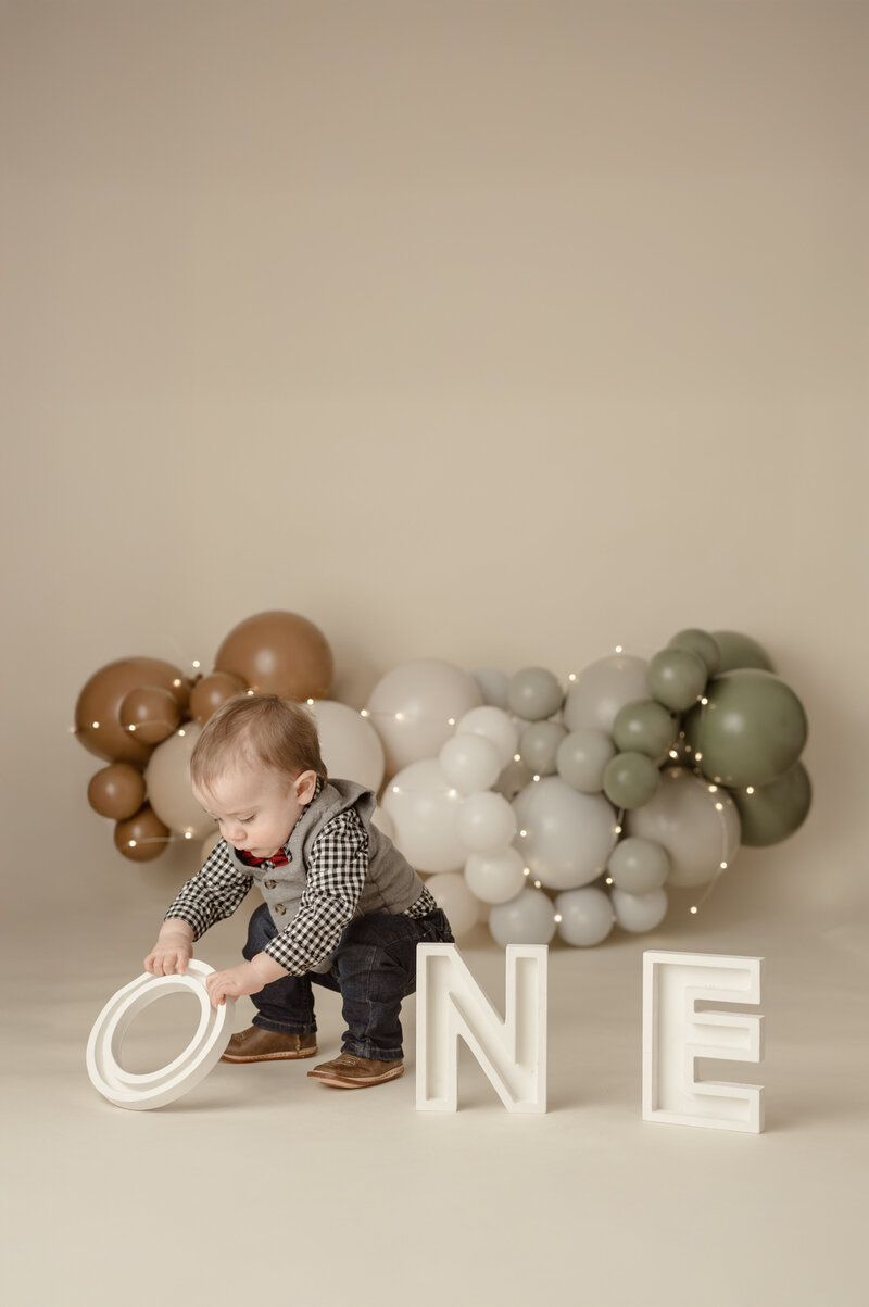 black and white baby studio portrait with baby bottom 