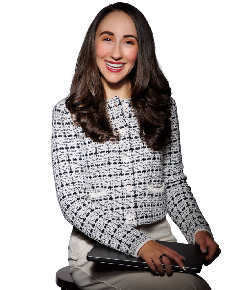 Professional brand portrait of a smiling woman in a white patterned jacket, sitting confidently with a tablet against a black background