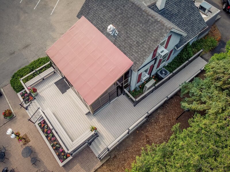 Top aerial view of Adele's Frozen Custard with new PVC deck and ADA ramp, two sets of stairs, and additional custom details. 