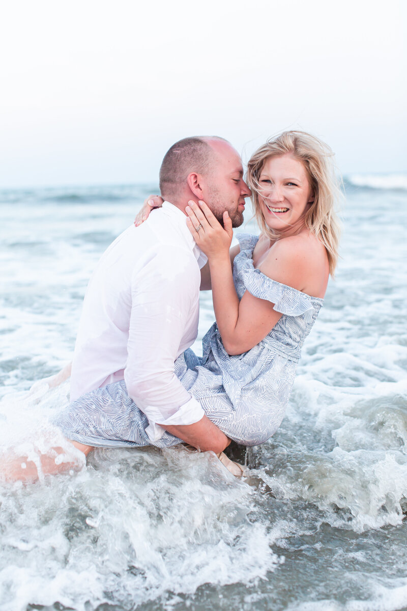 Husband and wife in ocean, photo in South Carolina, Plymouth Michigan Newborn photographer and husband
