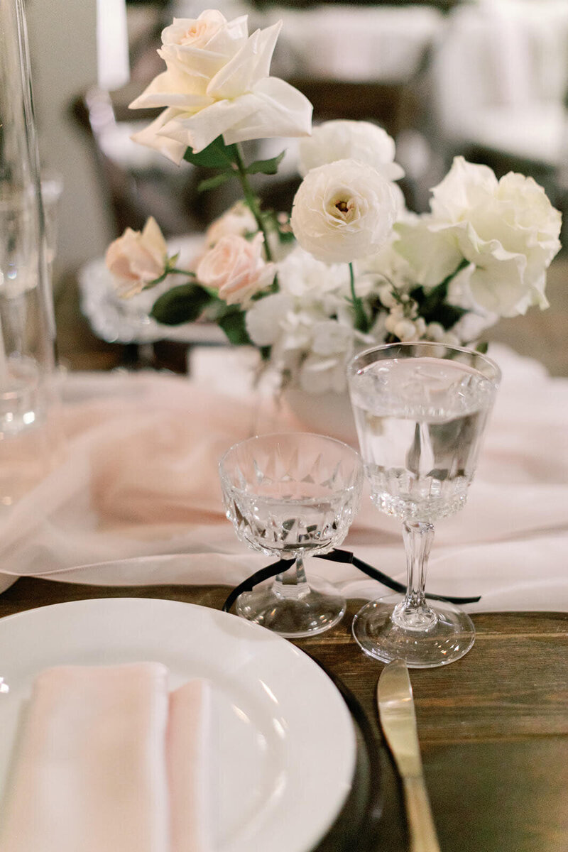 Wedding table decor with vase and flowers 
