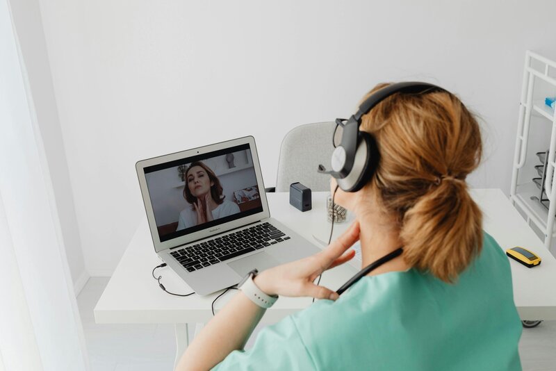 woman conducting a telehealth appointment