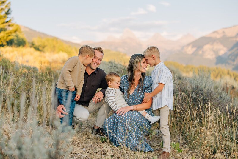 Family in a field in YEllowstone National Park