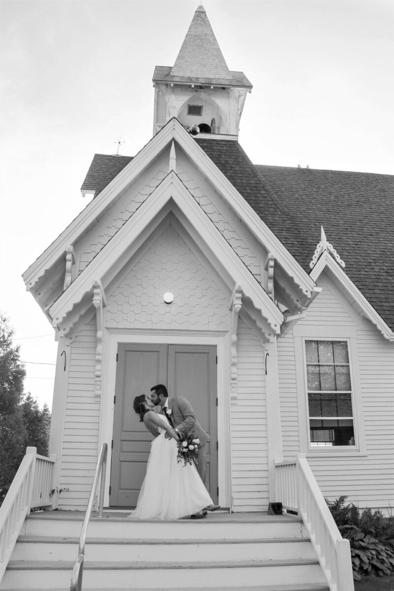 Bride and Groom kissing outside Church | Acadia Wedding Photography