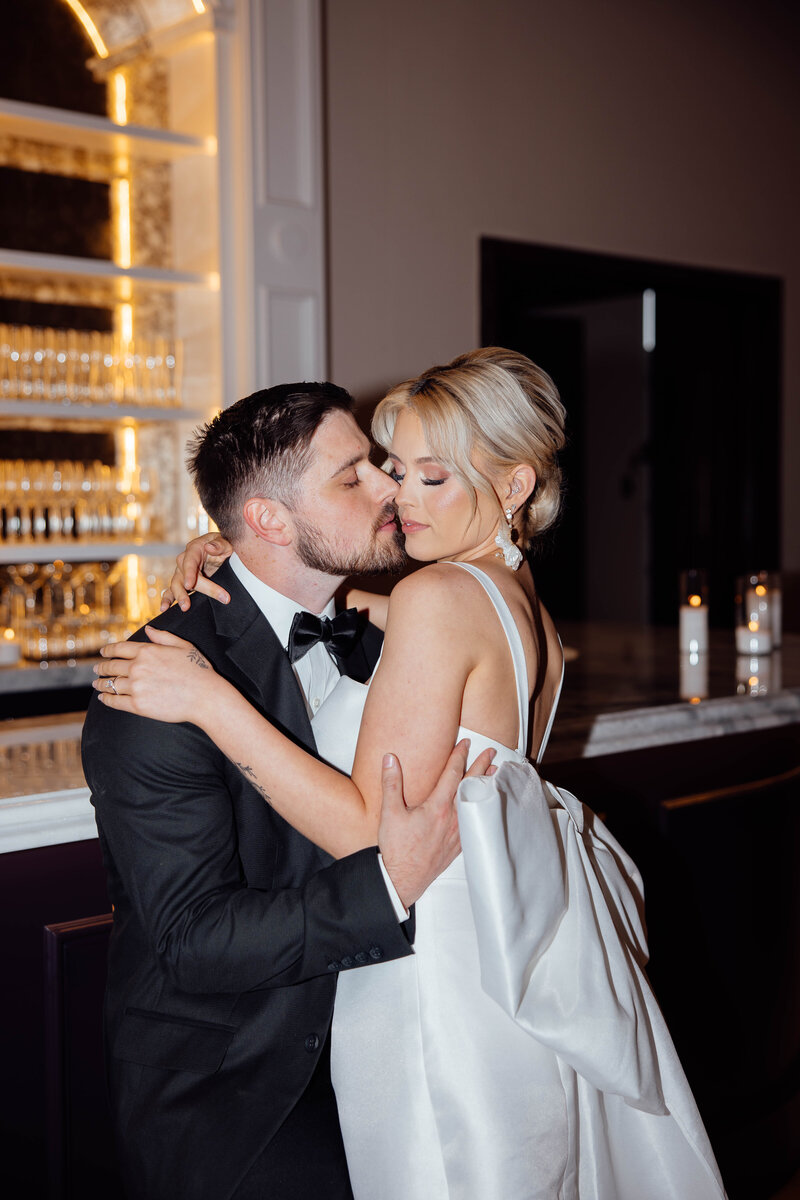 luxury wedding photographer document bride and groom in an upscale bar with flash photography