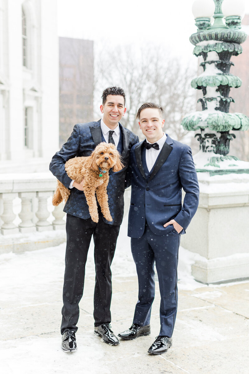 13_madison_capitol_wedding_grooms_holding_puppy