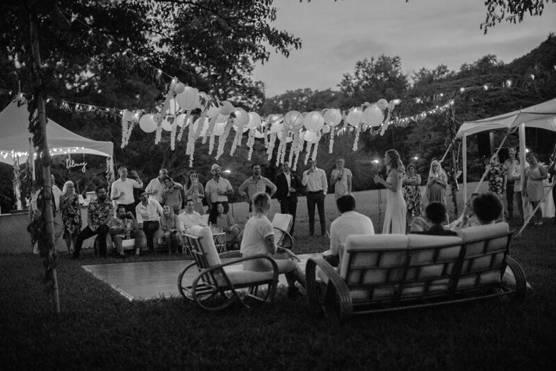 Guests mingling during cocktail hour of destination wedding