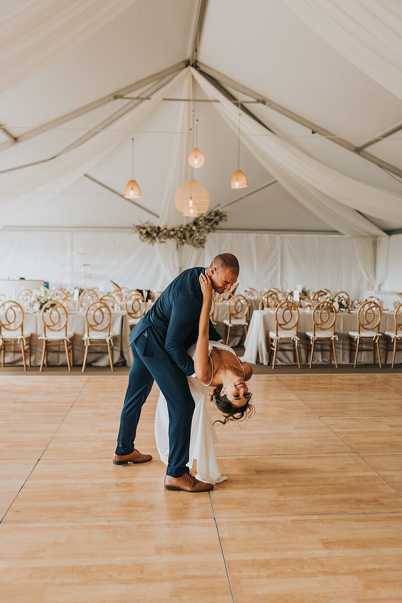 a Colorado wedding photography bride and groom in Steamboat Springs dancing on the dance floor with boho decor