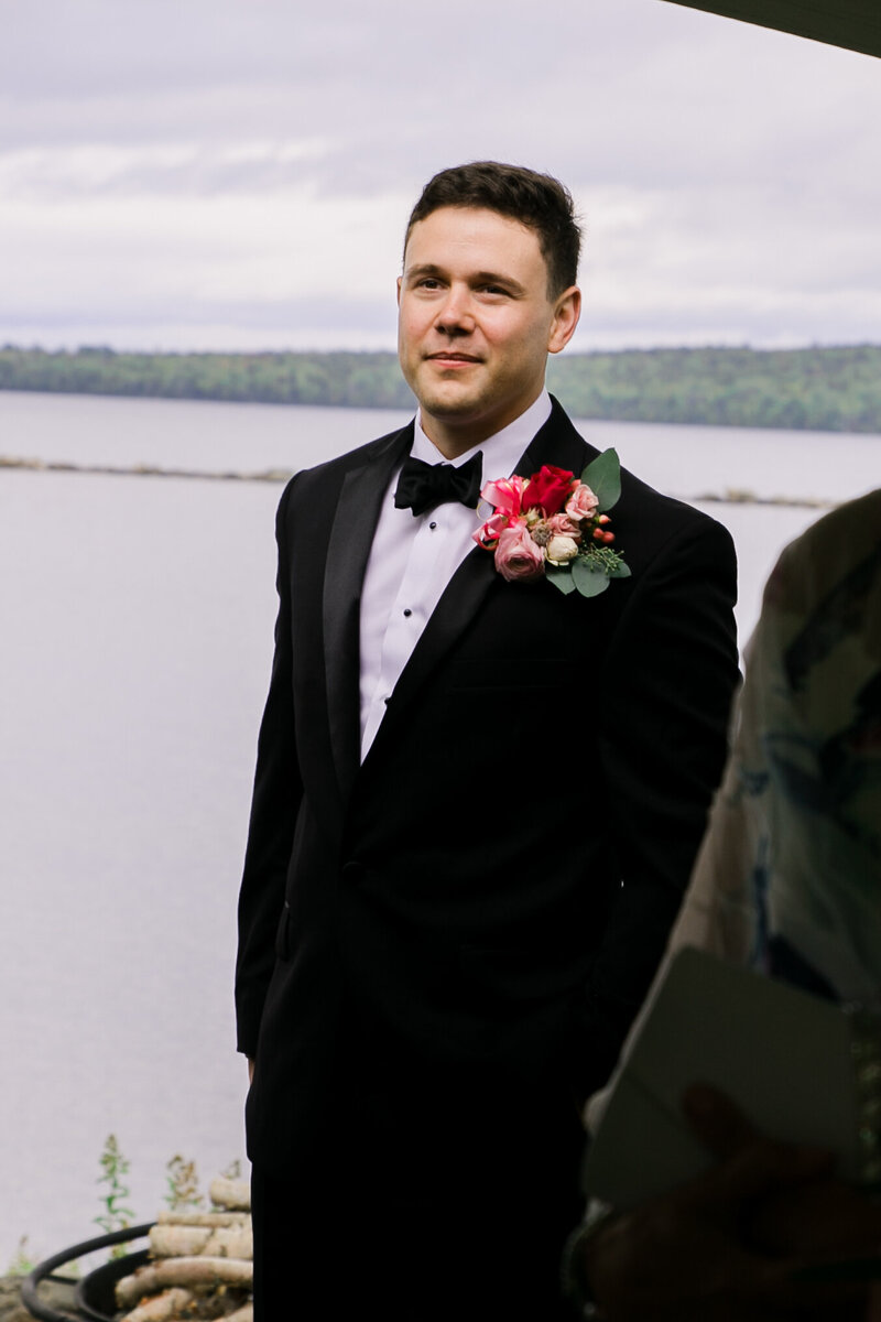 Groom standing at end of aisle | Wedding Photography