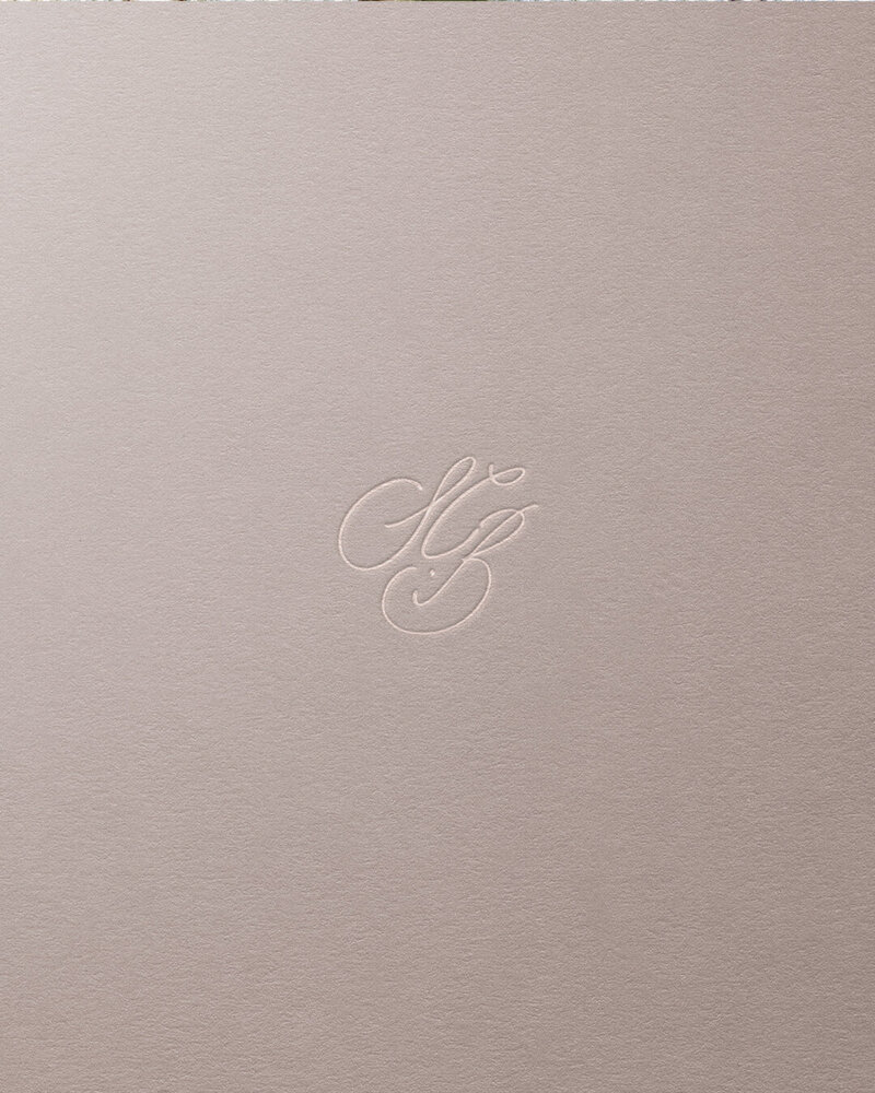 Bespoke SCB calligraphic monogram design, debossed on textured paper for Sarah C Brown Designs