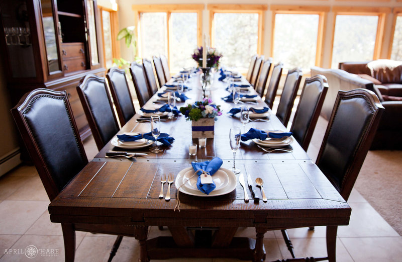 Grand long table with nice chairs for a private home wedding elopement dinner at Narrow Trail Ranch in Estes Park, Colorado