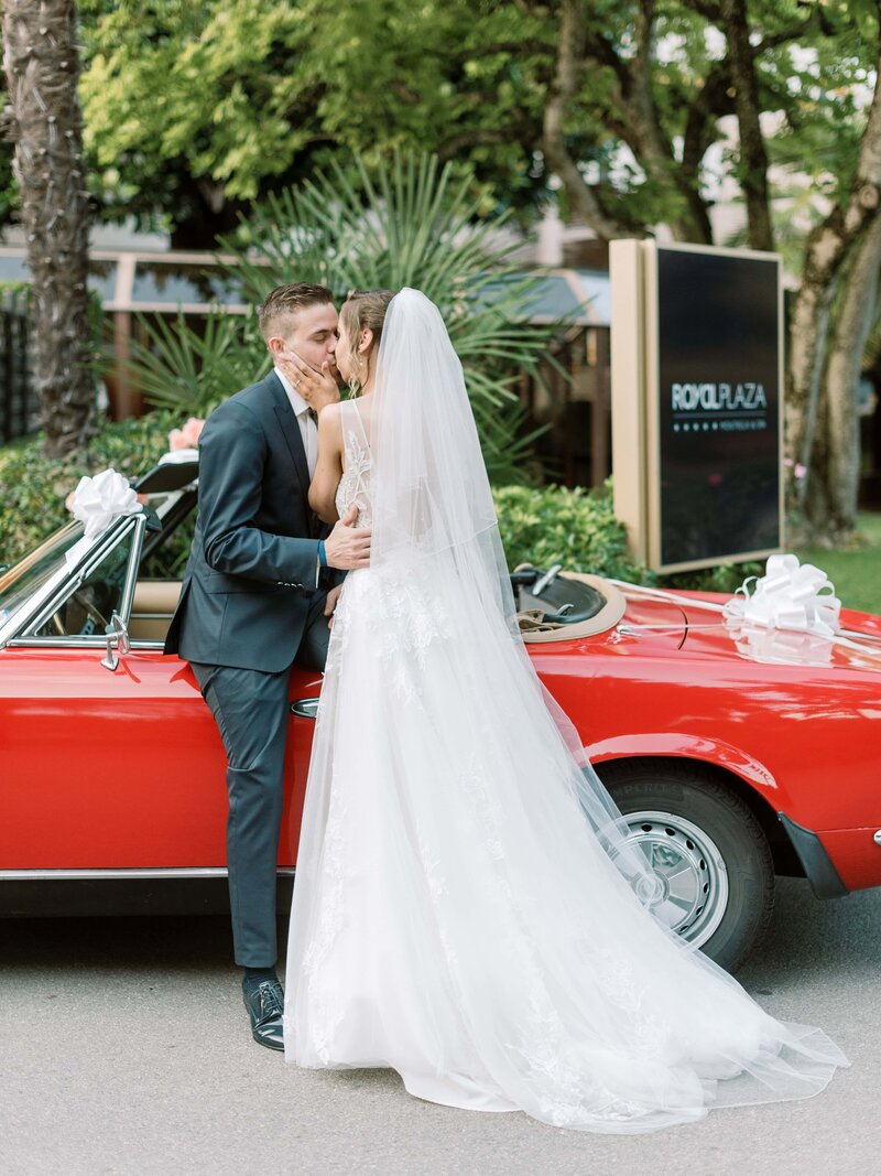 bride-and-groom-in-front-of-flower-arch