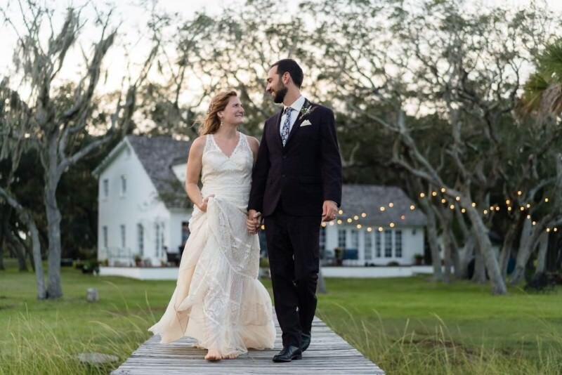 Newlyweds walking hand in hand