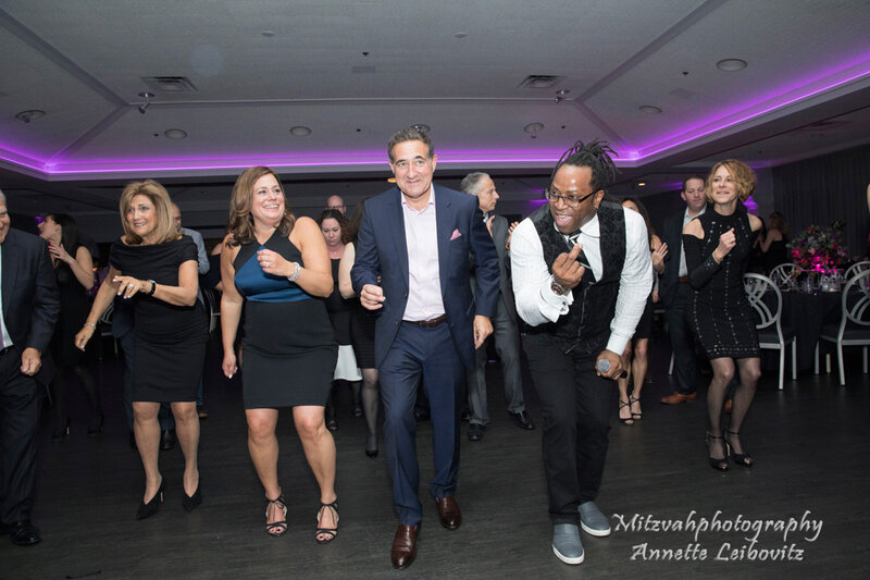 Adult guests dancing together at Chicago Bar Mitzvah with Charizma DJ and emcee