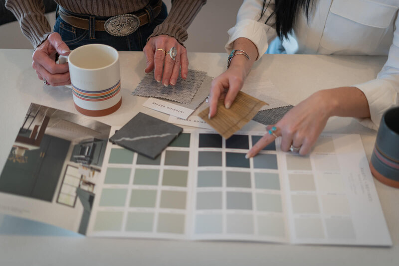 womens hands pointing at color swatches