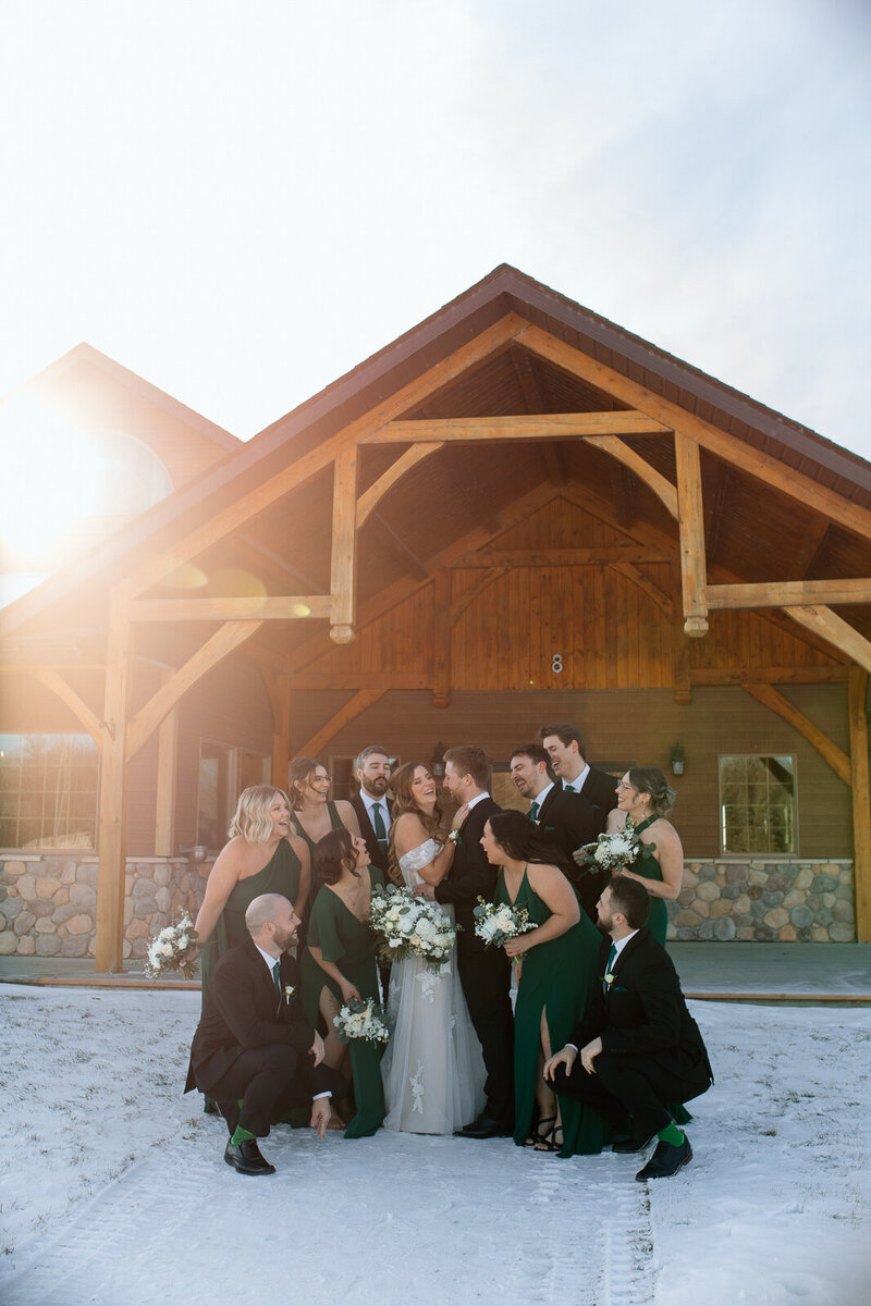 bride and groom first kiss in front of crowd