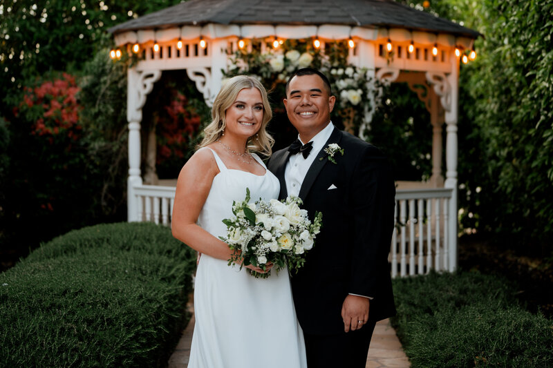 Overhead view of a bride and groom hugging on a staircase.