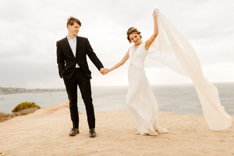 bride and groom at cliffside Laguna Beach elopement
