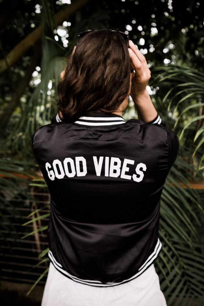 Danielle Elliott of Danielle Motif Photography in a good vibes jacket