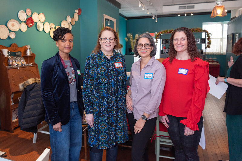 4 women business owners attending a high tea networking event.