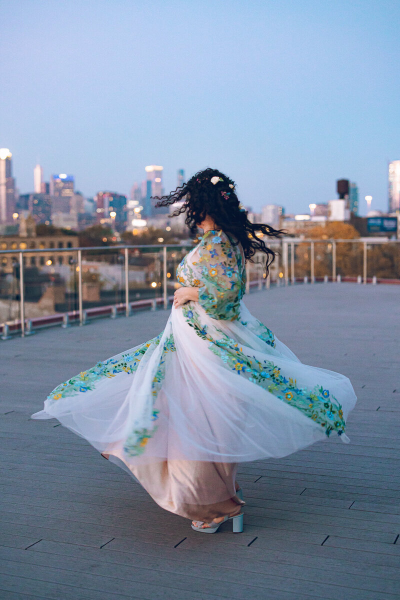 A bride shows off her wedding dress on the rooftop of Lacuna Lofts in Chicago