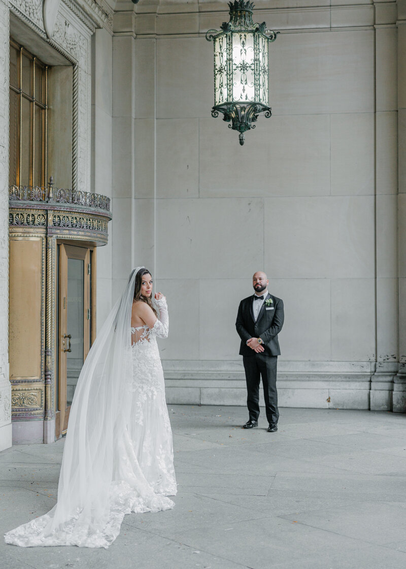 woman smiling while holding camera