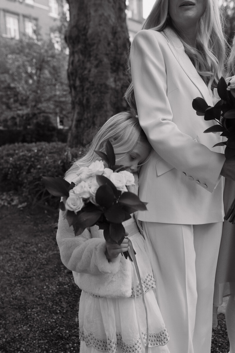 Wedding photographer captures couple taking a stroll hand in hand at their french chateau wedding.