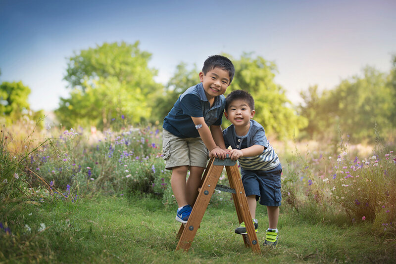 Boys playing in wildflowers