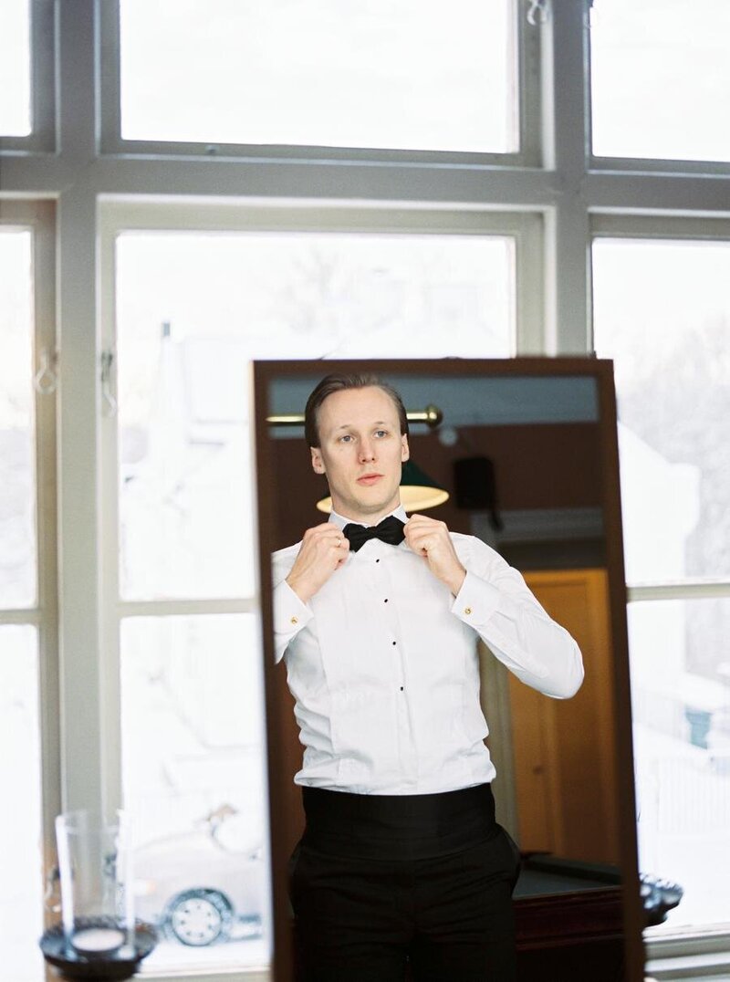 groom-in-front-of-mirror-winter-wedding-2-Brides-Photography_003