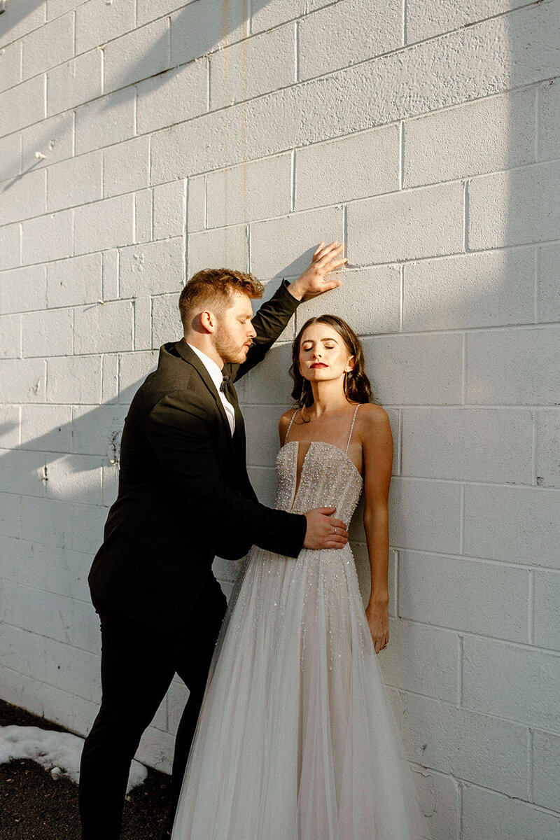 couple taking photos downtown in Denver, Colorado after their wedding