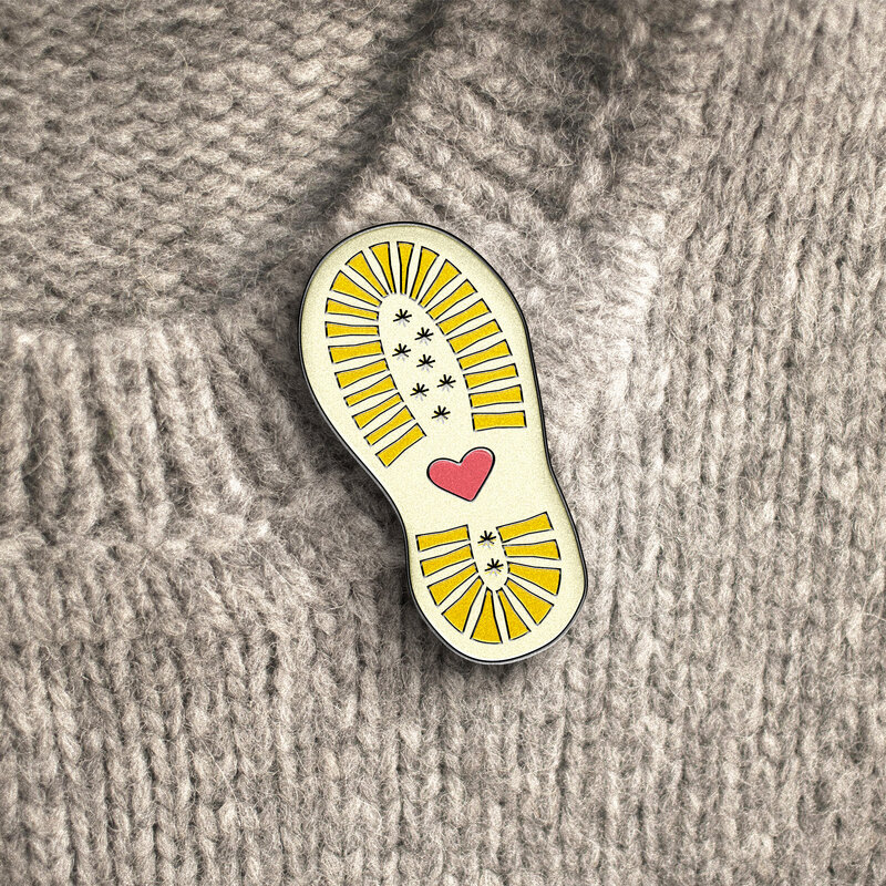 OAG rebrand enamel pin