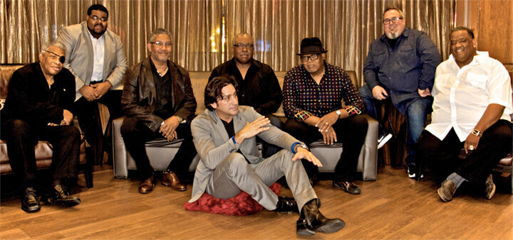 Steve Azar And The Kings Men band portrait seven musicians seated with Steve sitting on floor in front of them