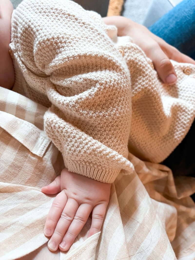 mother holding baby