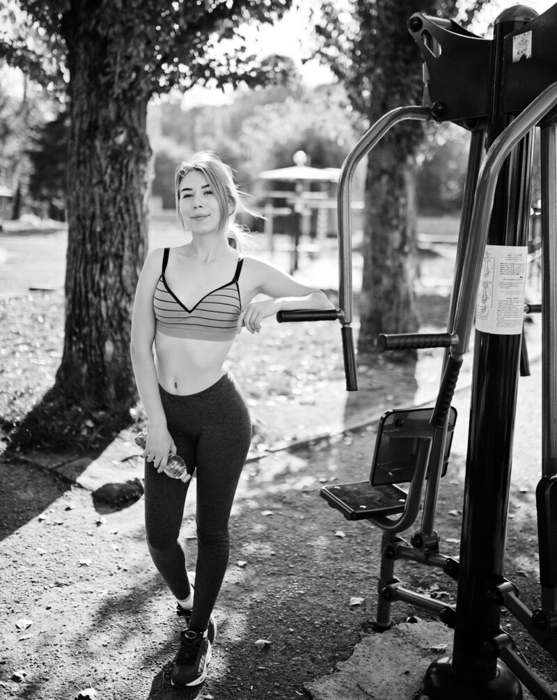 young-girl-has-training-doing-exercise-outdoors-street-simulators-sport-fitness-street-workout-concept (1)