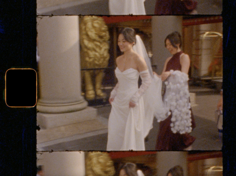 Snapshot from a Boston wedding film of the couple staring at eachother