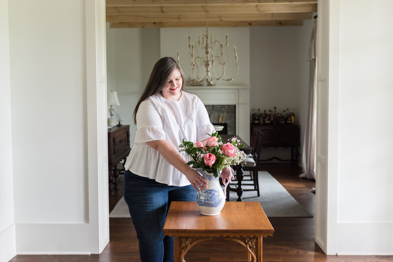 Lauren arranges pink roses in blue and white pitcher